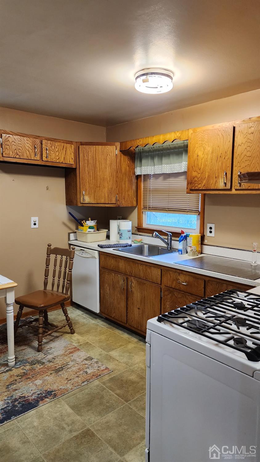 20 Middlesex Avenue Edison, NJ 08820 - Photo 22 of 28 a kitchen with stainless steel appliances granite countertop a sink stove and refrigerator