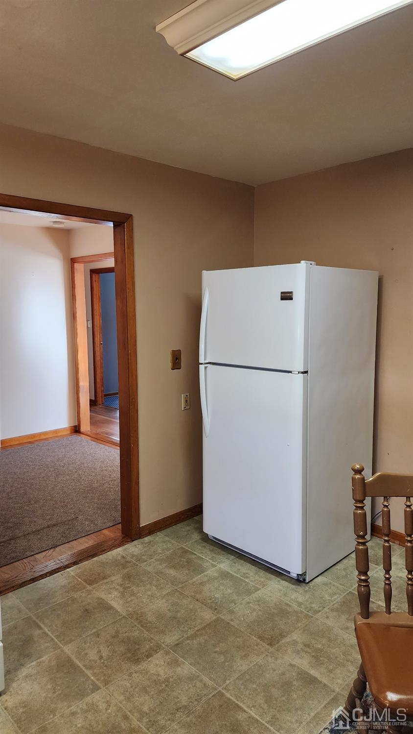20 Middlesex Avenue Edison, NJ 08820 - Photo 23 of 28 a view of a kitchen with refrigerator and table