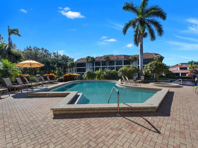a view of a swimming pool with a patio