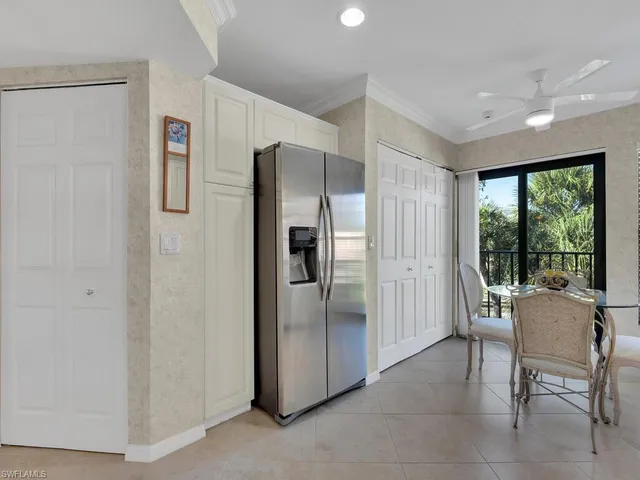 a kitchen with stainless steel appliances granite countertop a refrigerator and a refrigerator