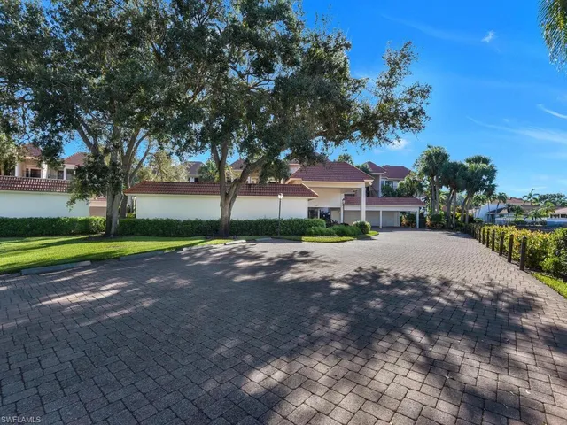 a view of street with large trees
