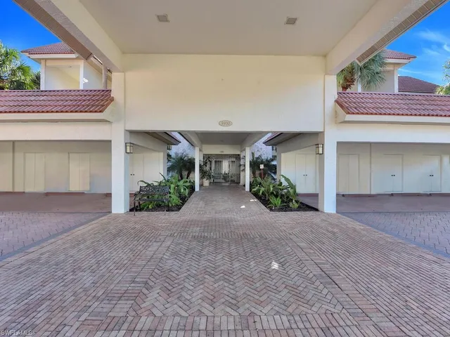 a view of a house with a garage and a window