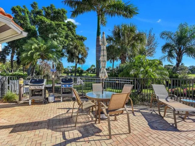a view of a chairs and table on the patio