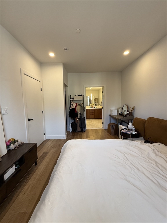 566 Columbus Avenue, Unit 211 Boston, MA 02118 - Photo 12 of 42 a bed room with a bed and a tv