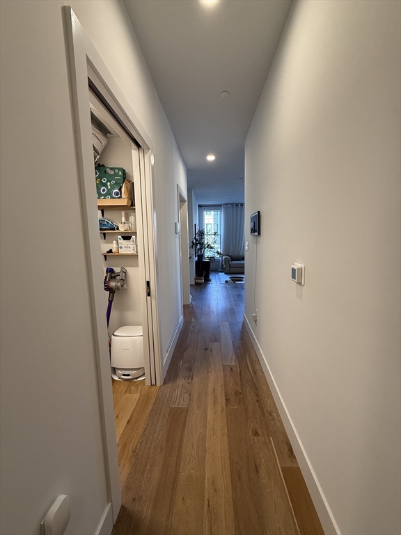 566 Columbus Avenue, Unit 211 Boston, MA 02118 - Photo 22 of 42 wooden floor in a hall with a fireplace