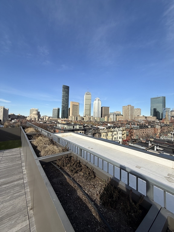 566 Columbus Avenue, Unit 211 Boston, MA 02118 - Photo 27 of 42 a view of city from a balcony