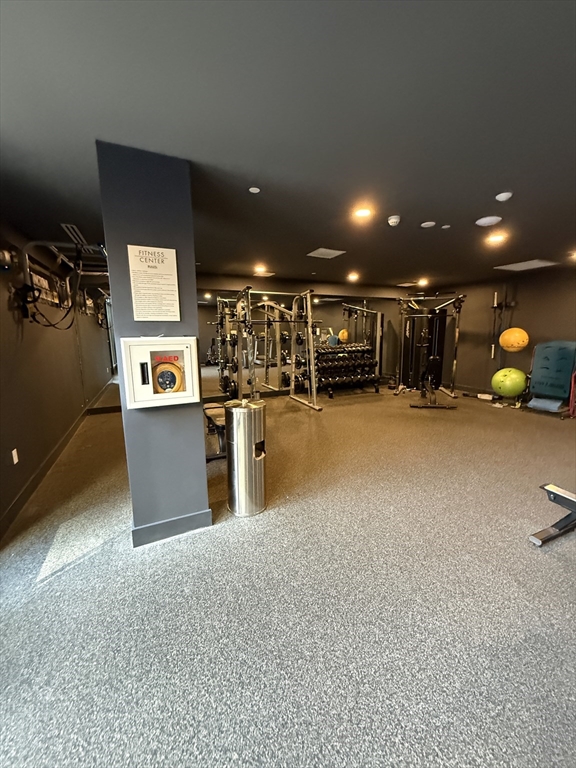 566 Columbus Avenue, Unit 211 Boston, MA 02118 - Photo 30 of 42 a view of a room with gym equipment and a large window