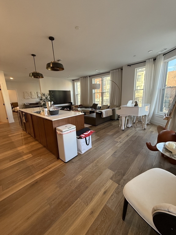 566 Columbus Avenue, Unit 211 Boston, MA 02118 - Photo 3 of 42 a living room with furniture and a flat screen tv