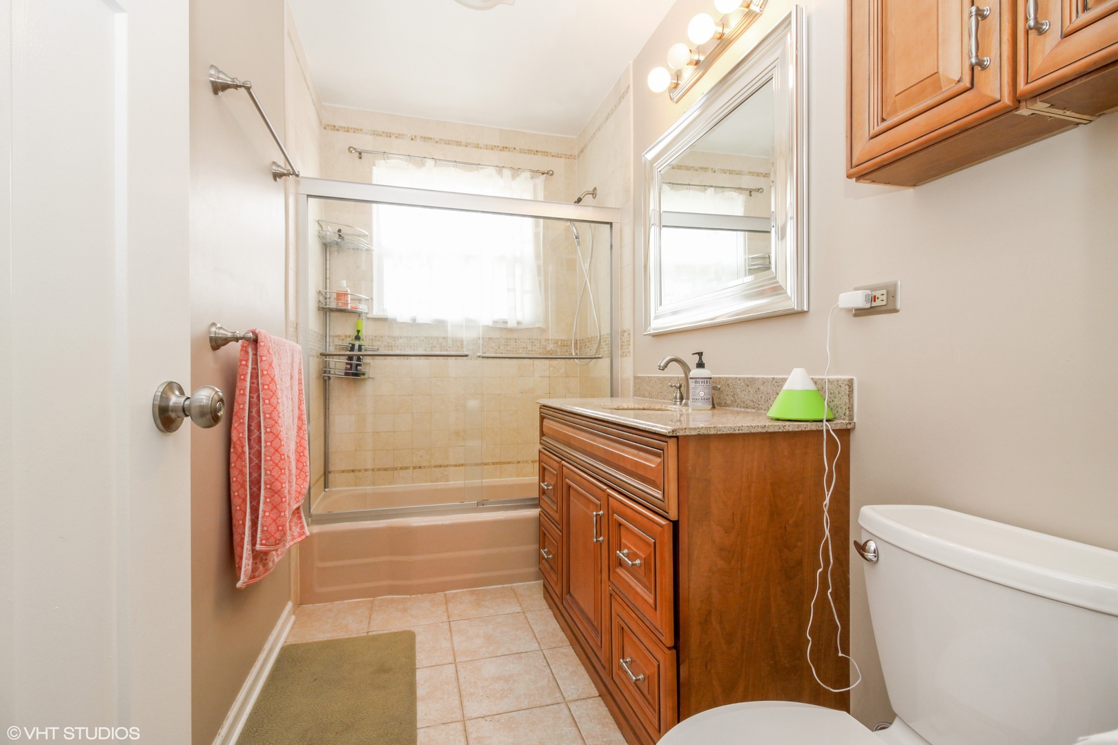 244 Glendale Road Glenview, IL 60025 - Photo 12 of 25 a bathroom with a granite countertop sink toilet and shower