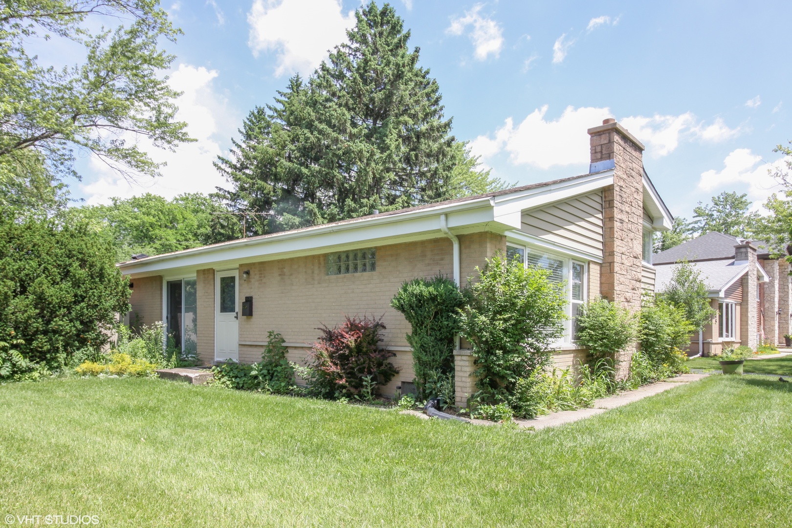 244 Glendale Road Glenview, IL 60025 - Photo 20 of 25 a view of house with a yard and potted plants