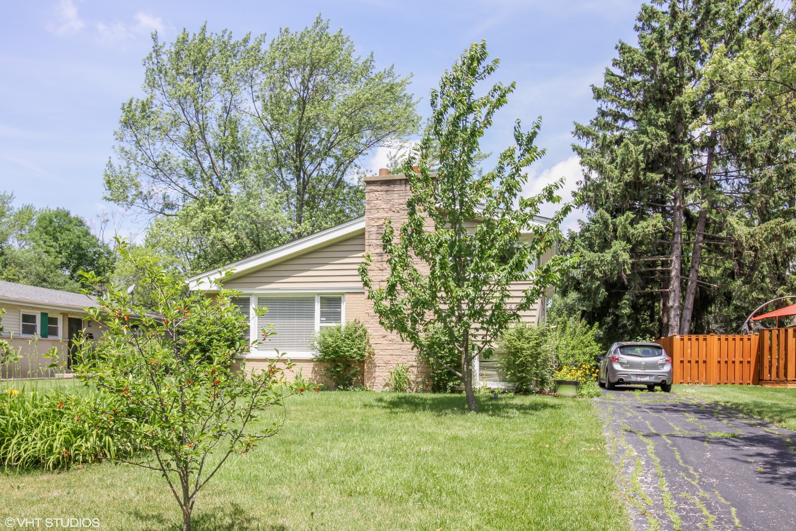 244 Glendale Road Glenview, IL 60025 - Photo 24 of 25 a yellow house with trees in front of it