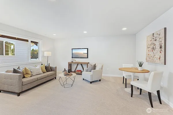 a living room with furniture and a large window