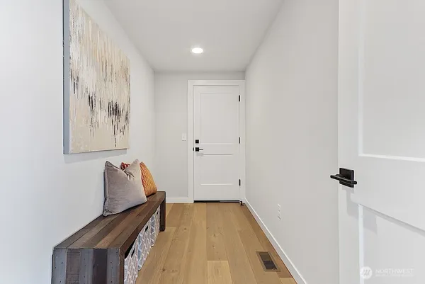 a view of room with stairs and wooden floor