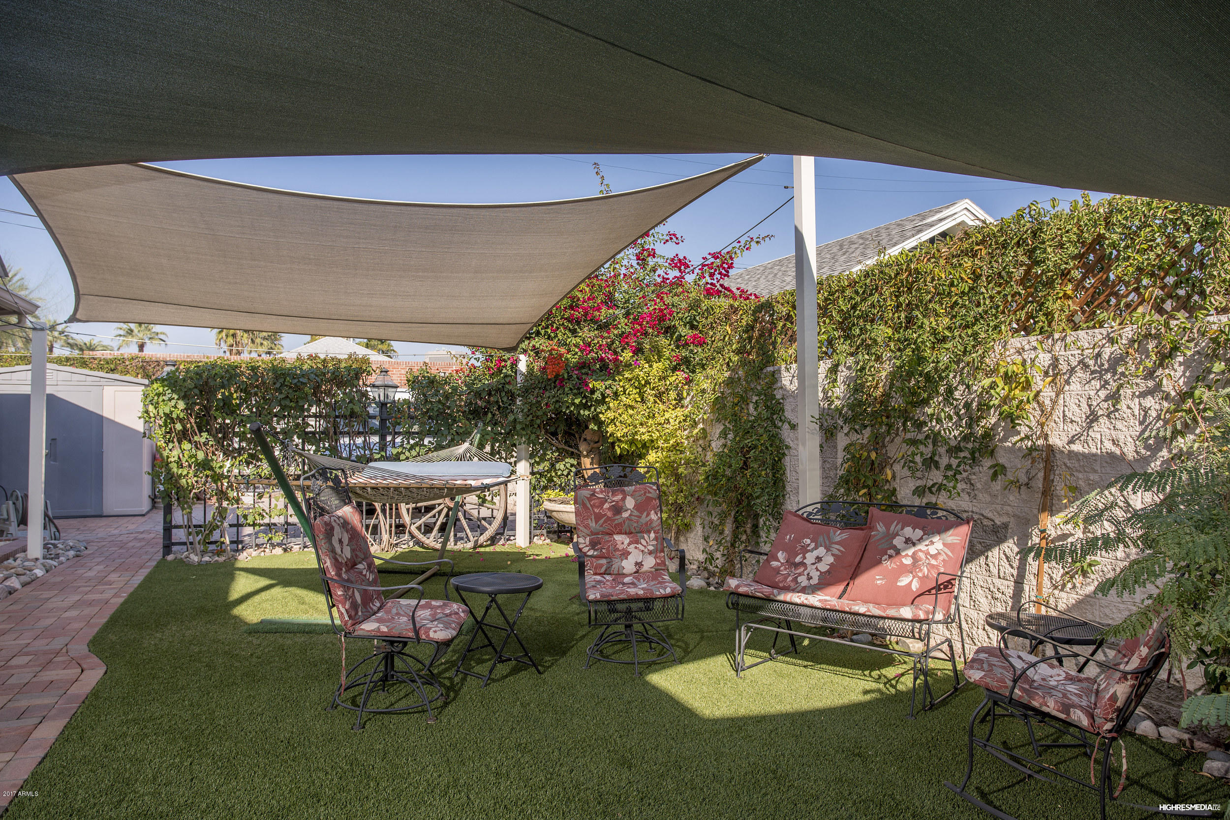 108 West Granada Road Phoenix, AZ 85003 - Photo 5 of 27 a backyard of a house with table and chairs