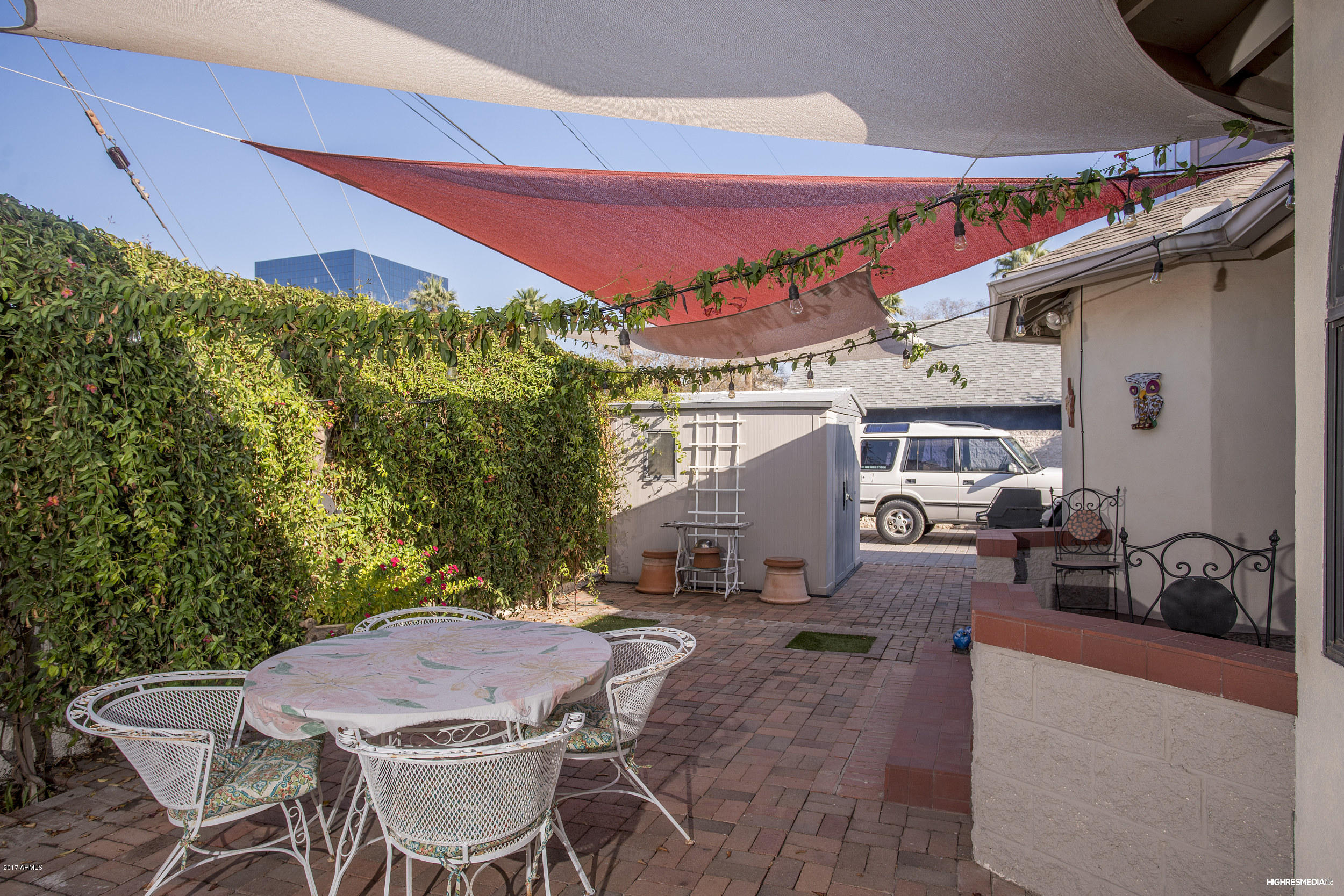 108 West Granada Road Phoenix, AZ 85003 - Photo 8 of 27 a patio with a table and chairs and potted plants