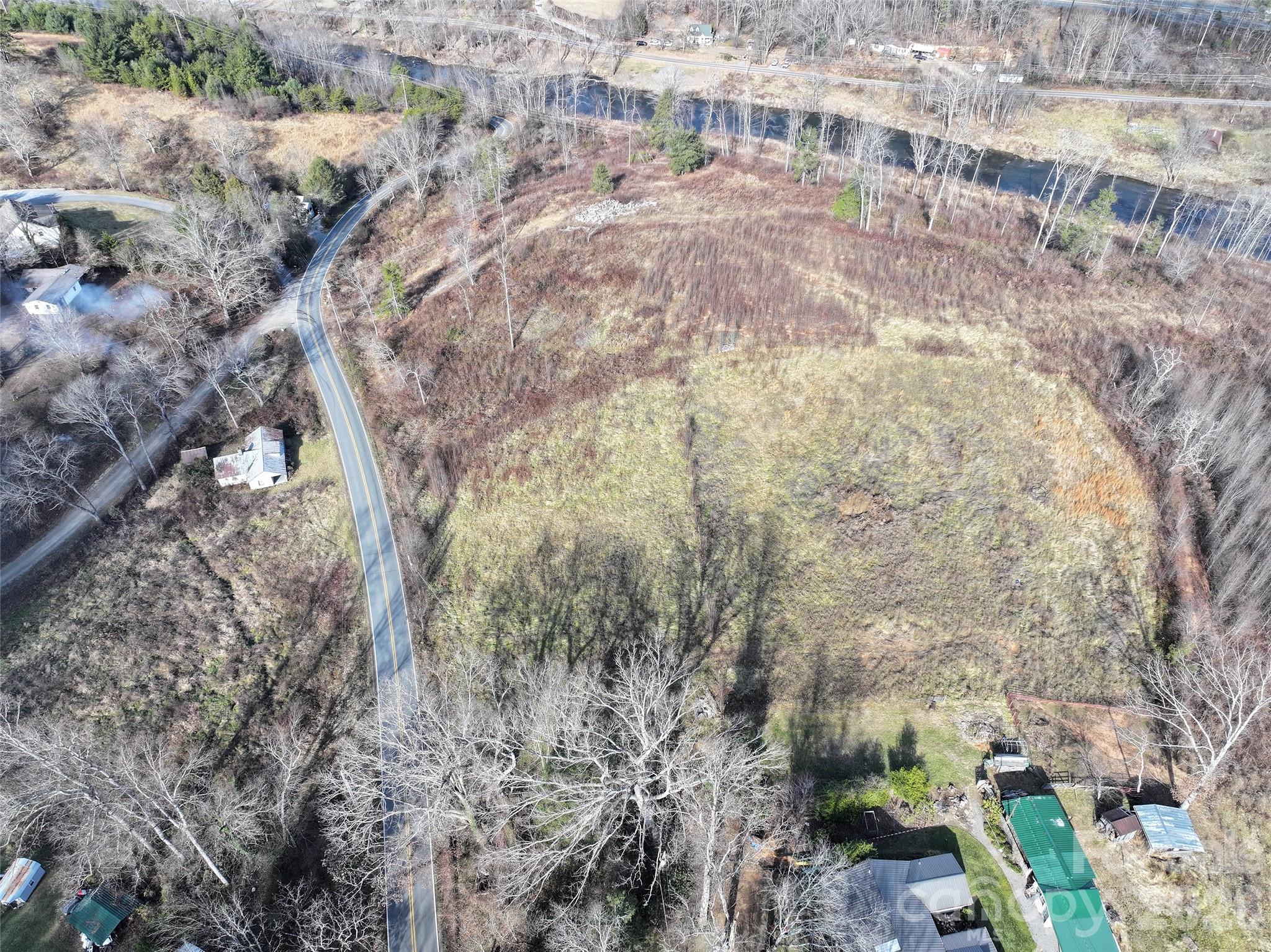 347 Richland Creek Road Clyde, NC 28721 - Photo 24 of 37 a view of a yard from a backyard