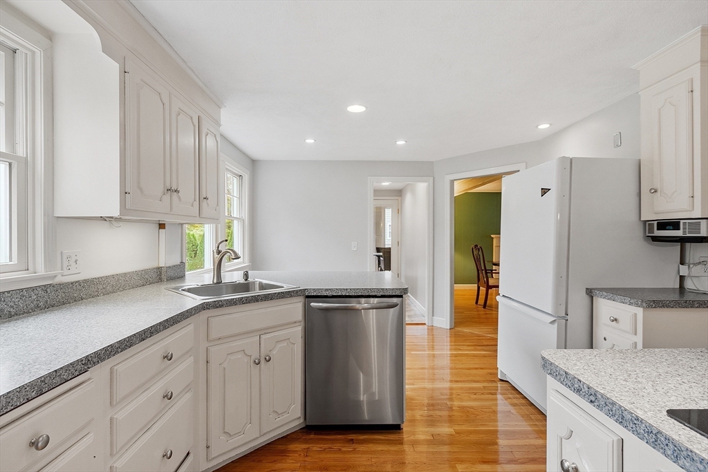 80 North Branch Road Concord, MA 01742 - Photo 12 of 35 a kitchen with stainless steel appliances granite countertop a sink a stove and cabinets
