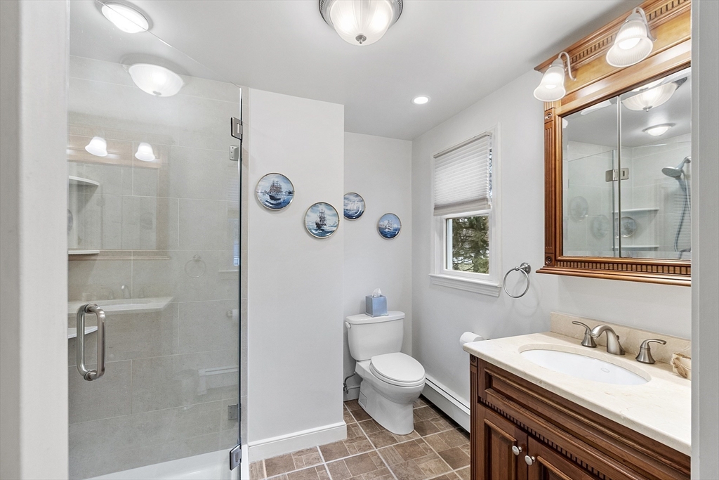 80 North Branch Road Concord, MA 01742 - Photo 20 of 35 a bathroom with a sink a toilet and a mirror