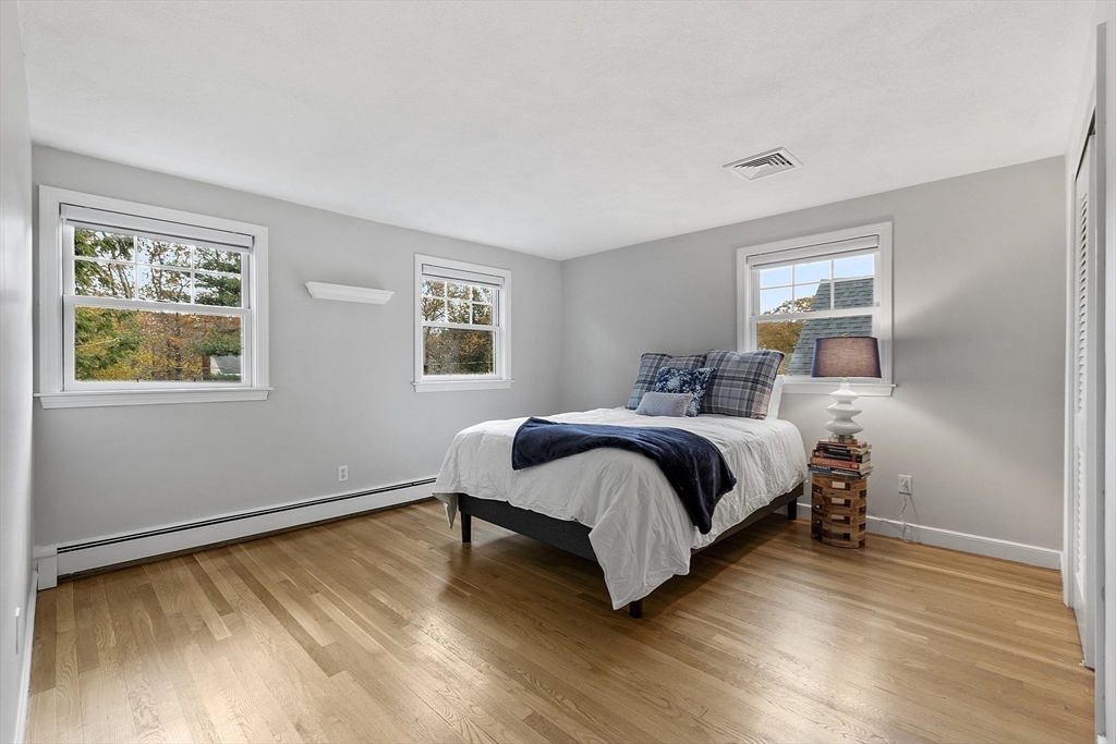 80 North Branch Road Concord, MA 01742 - Photo 23 of 35 a bedroom with a bed and wooden floor