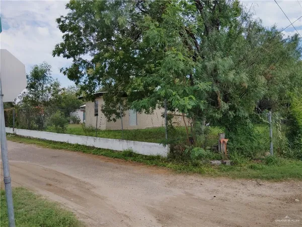a view of a house with a street