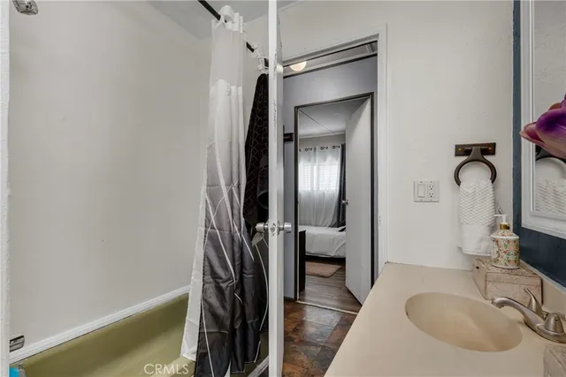 a bathroom with a sink and a mirror