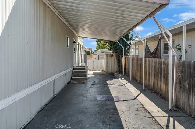 a view of a house with wooden walls