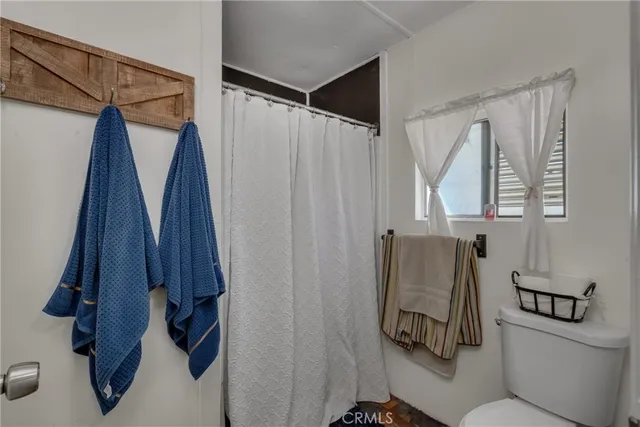 a bathroom with a shower curtain and a sink