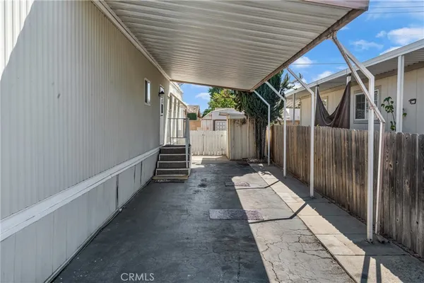 a view of a house with wooden walls