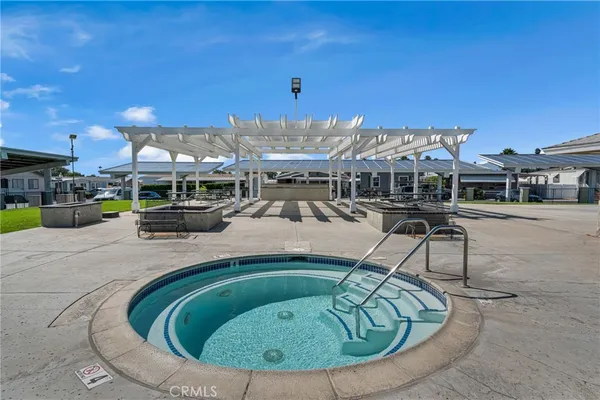 a view of a swimming pool with a patio