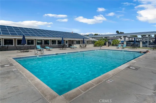 a view of a house with a backyard porch and sitting area
