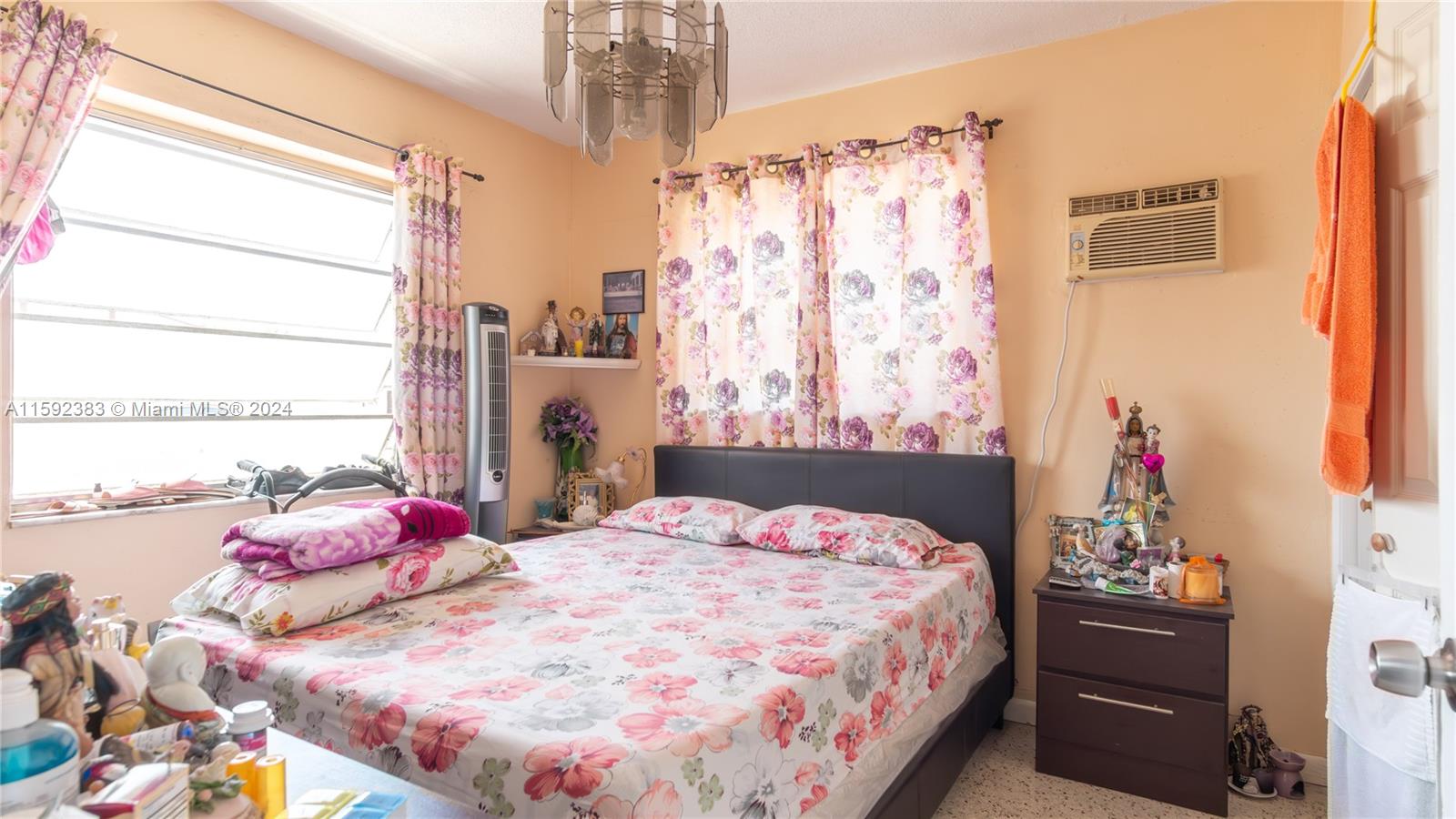 23 West 13th Street Hialeah, FL 33010 - Photo 17 of 54 a bedroom with a bed and a window