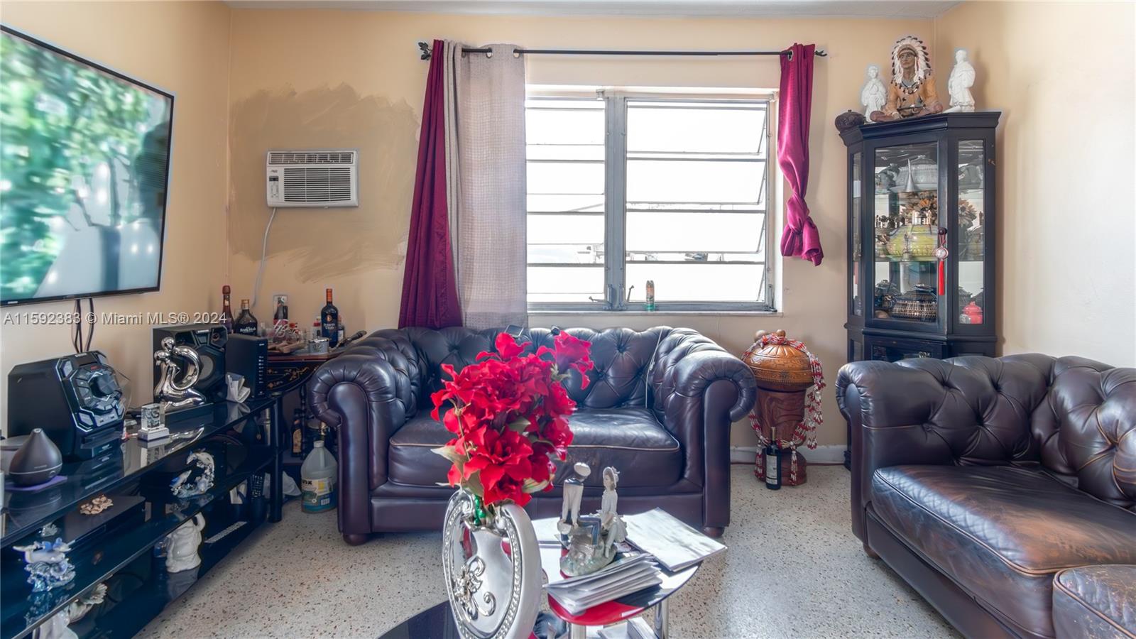 23 West 13th Street Hialeah, FL 33010 - Photo 20 of 54 a living room with furniture a flat screen tv and a window