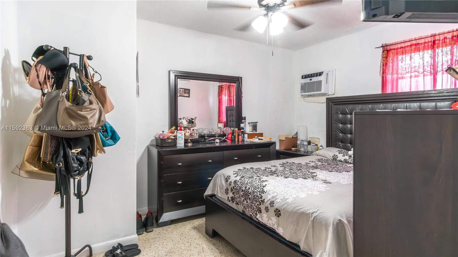 23 West 13th Street Hialeah, FL 33010 - Photo 29 of 54 a bedroom with a bed and a mirror