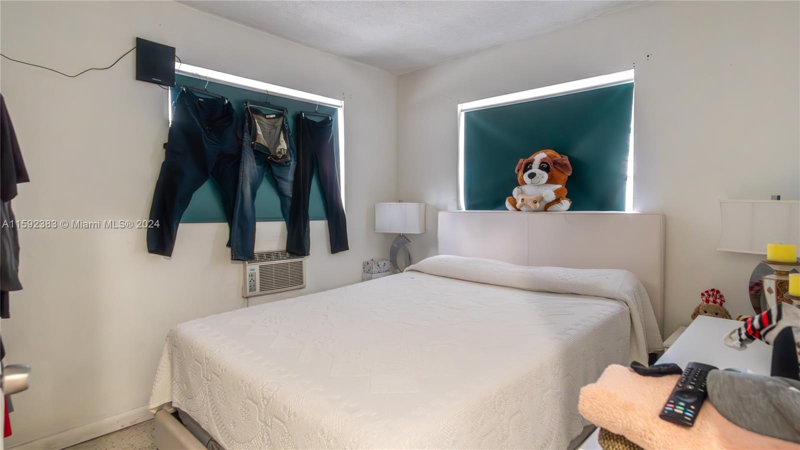 23 West 13th Street Hialeah, FL 33010 - Photo 33 of 54 a bedroom with a bed and a painting on the wall