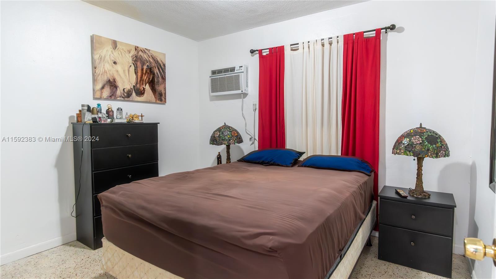 23 West 13th Street Hialeah, FL 33010 - Photo 38 of 54 a bedroom with a bed and a closet