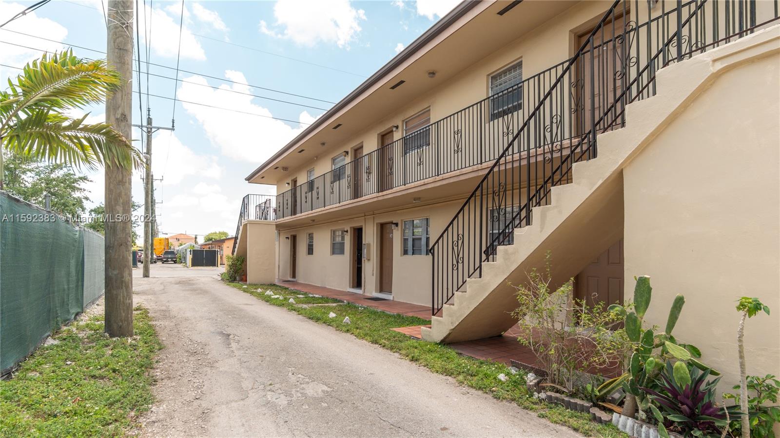 23 West 13th Street Hialeah, FL 33010 - Photo 8 of 54 a view of a house with wooden stairs