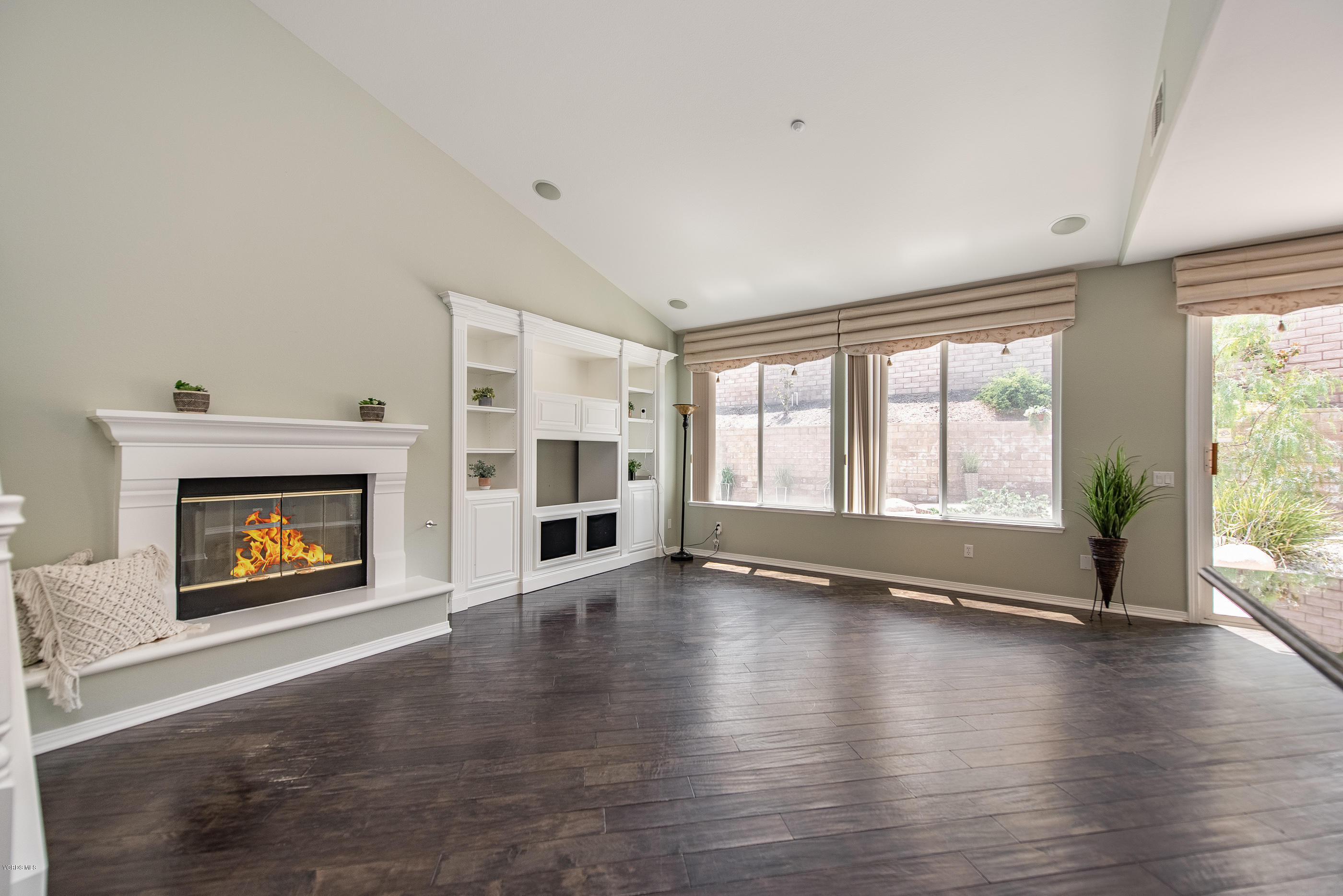 1553 Hidden Ranch Drive Simi Valley, CA 93063 - Photo 14 of 45 an empty room with floor to ceiling windows and fireplace