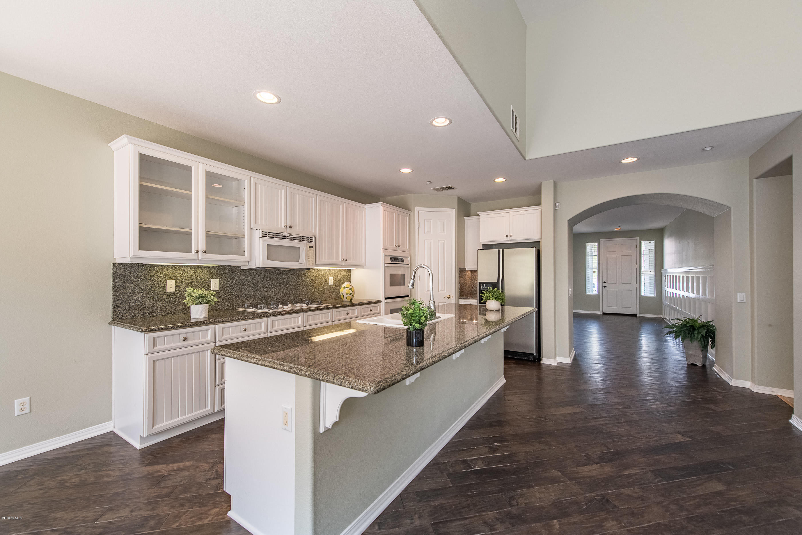1553 Hidden Ranch Drive Simi Valley, CA 93063 - Photo 8 of 45 a kitchen with stainless steel appliances granite countertop a stove and a sink