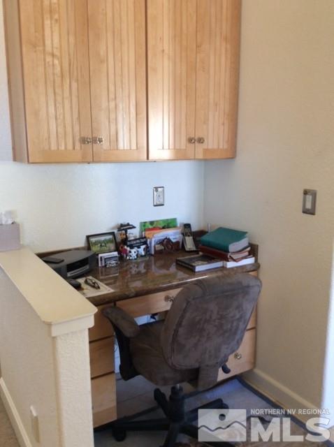 3950 Schindler Road Fallon, NV 89406 - Photo 12 of 24 a kitchen with a sink a stove and white cabinets