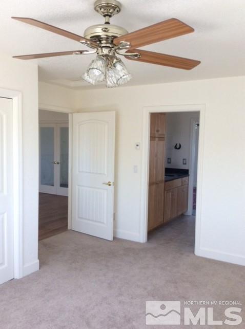 3950 Schindler Road Fallon, NV 89406 - Photo 18 of 24 a view of a hallway with a chandelier