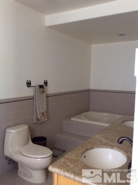 3950 Schindler Road Fallon, NV 89406 - Photo 20 of 24 a bathroom with a toilet and a sink