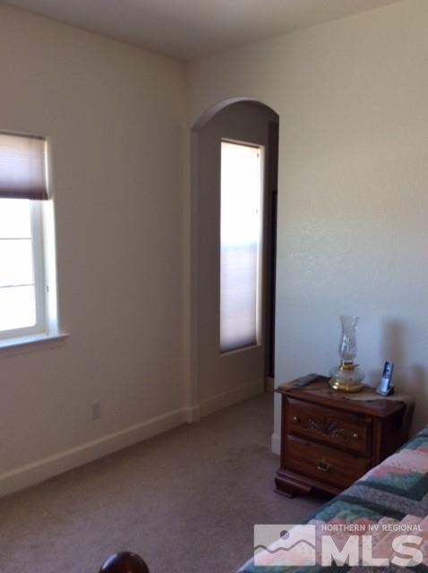 3950 Schindler Road Fallon, NV 89406 - Photo 22 of 24 a room with a dresser and a window