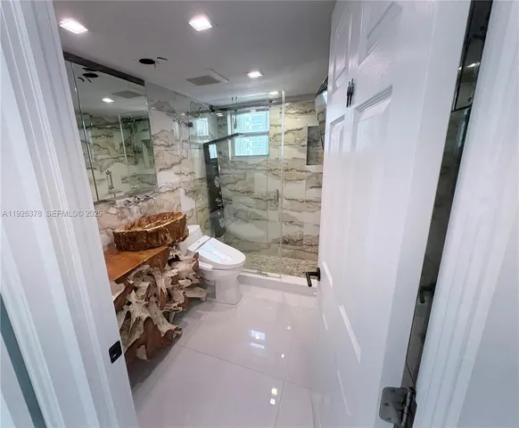 a bathroom with a shower and a toilet