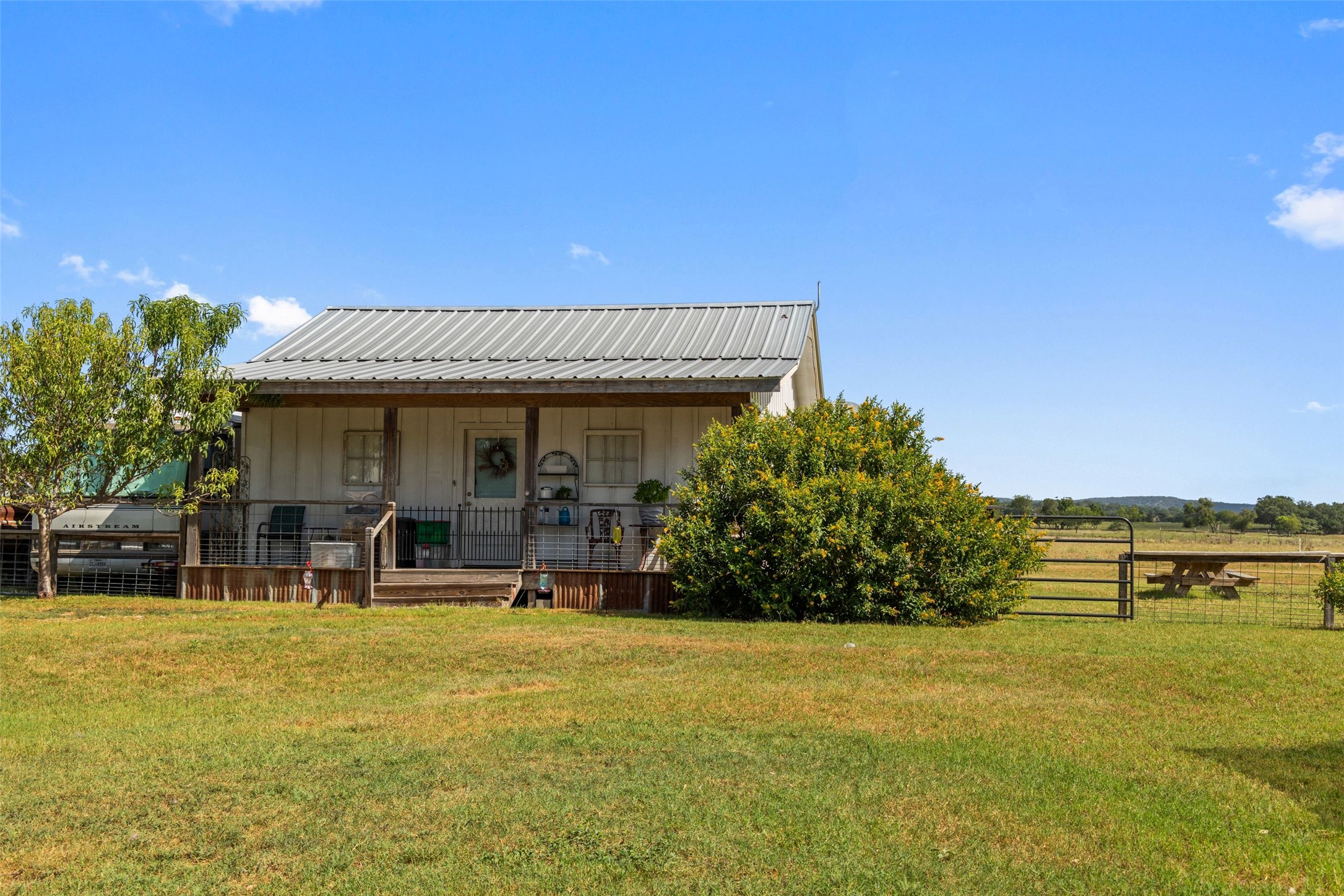 3764 Ranch Road 1623 Blanco, TX 78606 - Photo 18 of 36 Metal roofing and a wide front porch define this charming rural residence.
