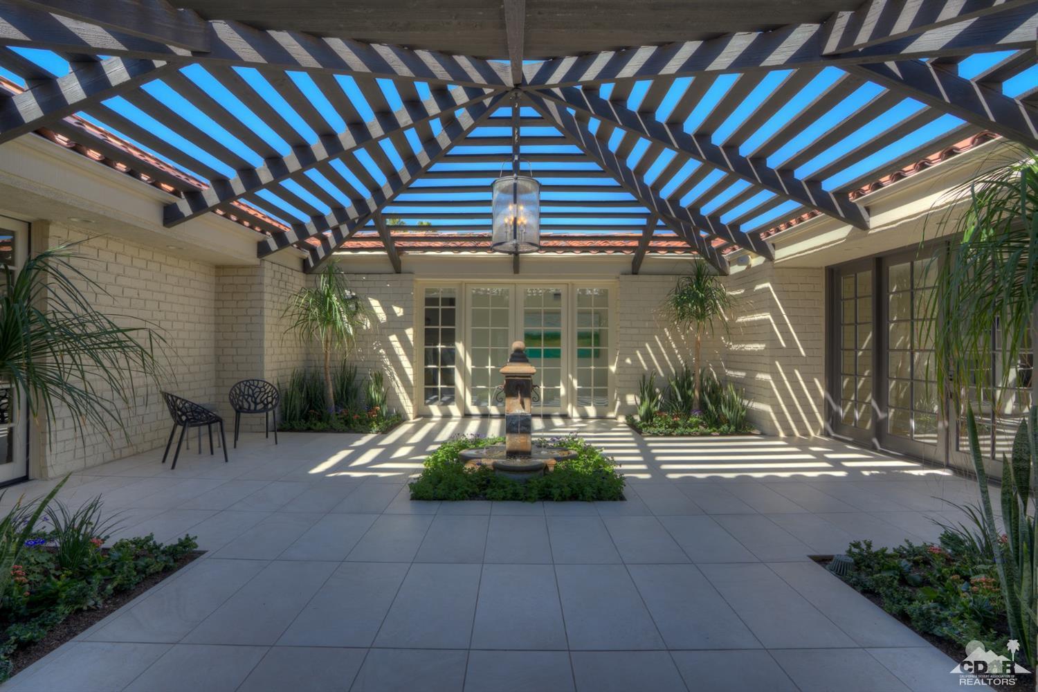 40757 Thunderbird Road Rancho Mirage, CA 92270 - Photo 18 of 70 a view of a chairs and table in the patio
