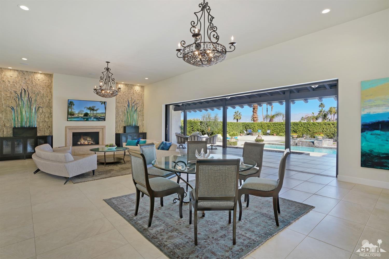 40757 Thunderbird Road Rancho Mirage, CA 92270 - Photo 22 of 70 a dining room with furniture a livingroom and outdoor view