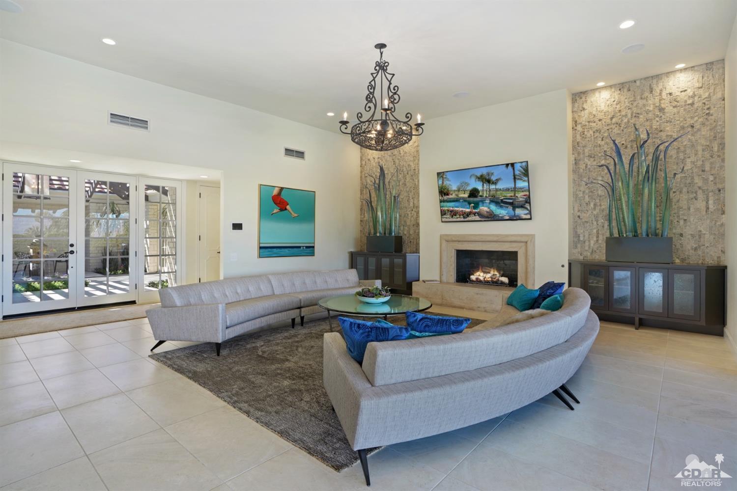 40757 Thunderbird Road Rancho Mirage, CA 92270 - Photo 23 of 70 a living room with furniture and a fireplace