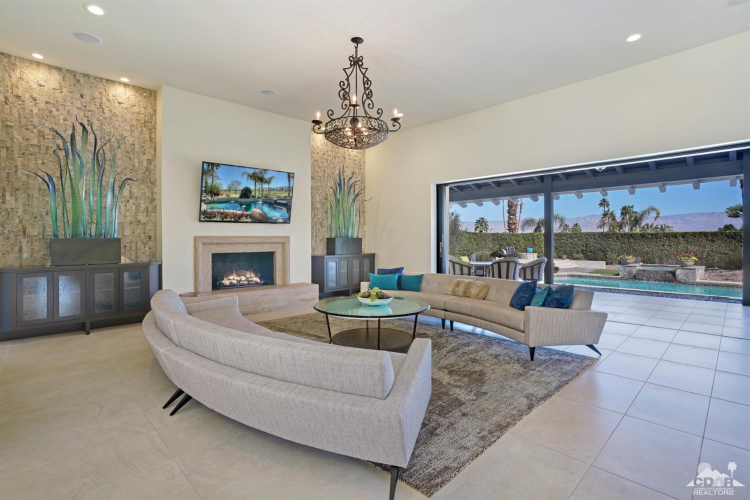 40757 Thunderbird Road Rancho Mirage, CA 92270 - Photo 24 of 70 a living room with furniture and a fireplace