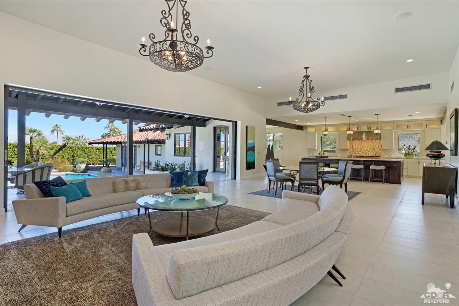 40757 Thunderbird Road Rancho Mirage, CA 92270 - Photo 25 of 70 a living room with furniture and a large window
