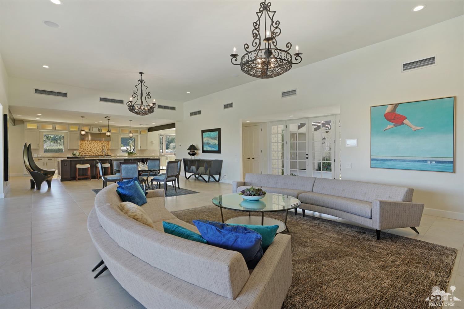 40757 Thunderbird Road Rancho Mirage, CA 92270 - Photo 26 of 70 a living room with furniture kitchen view and a chandelier